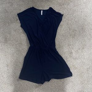 Navy romper from Pink Lily boutique. Great condition. Stretchy fabric. Size S.